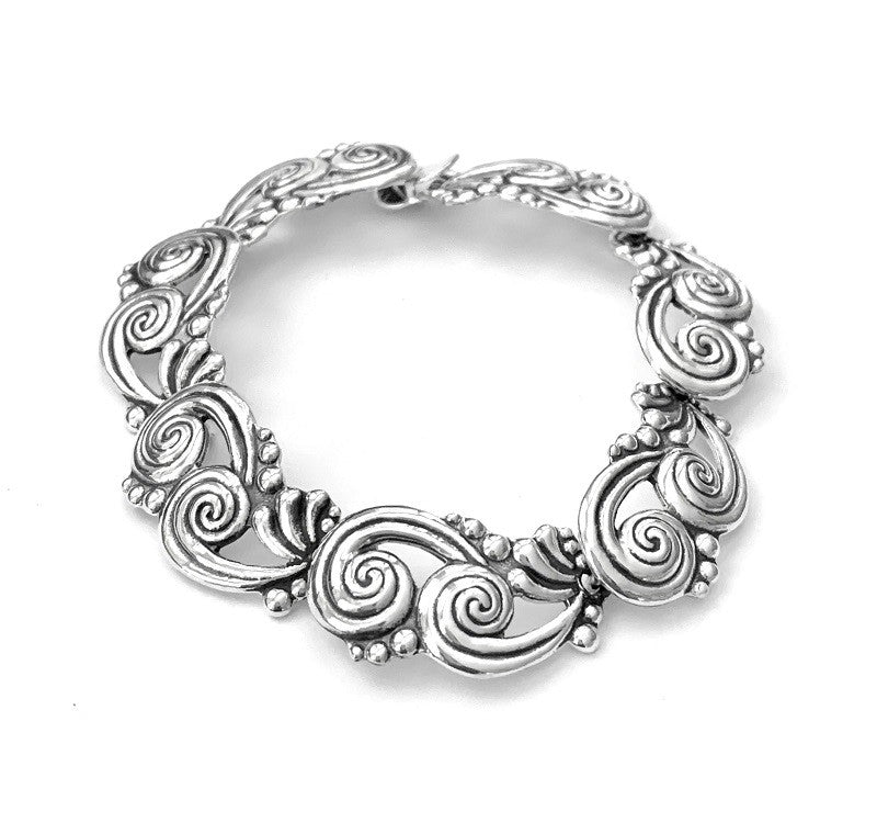 TWO JOINED SWIRLS SILVER BRACELET