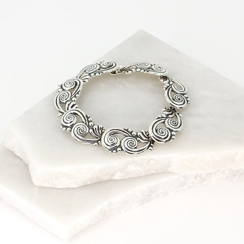 TWO JOINED SWIRLS SILVER BRACELET