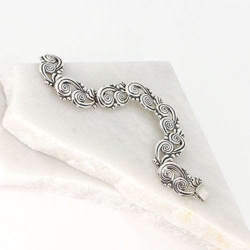 TWO JOINED SWIRLS SILVER BRACELET