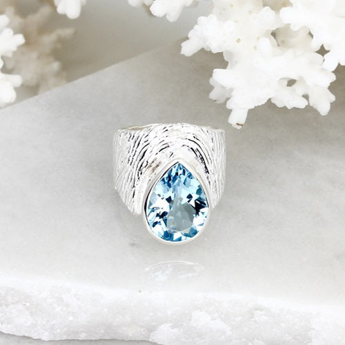 PEAR SHAPED BLUE TOPAZ SILVER RING